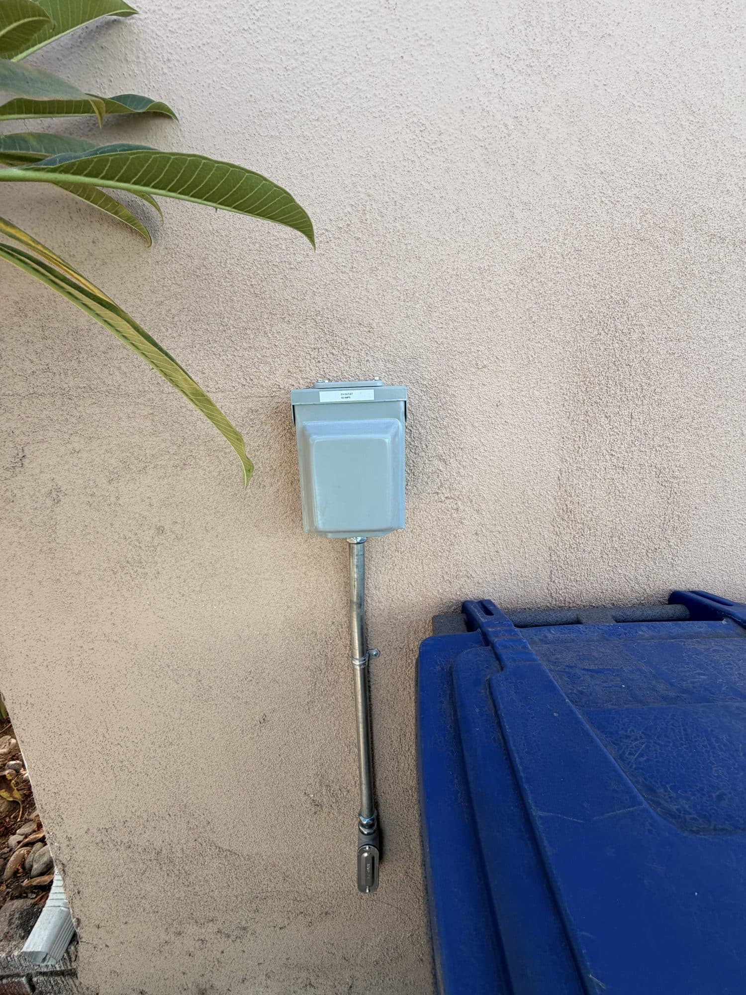 Exterior wall prepared with a dedicated EV charging circuit near the driveway